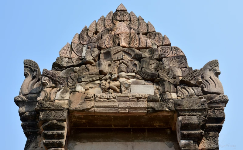 Carved Stone pieces on top of a temple building