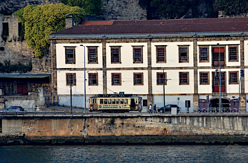 Old street car in Porto at the banks of Douro River