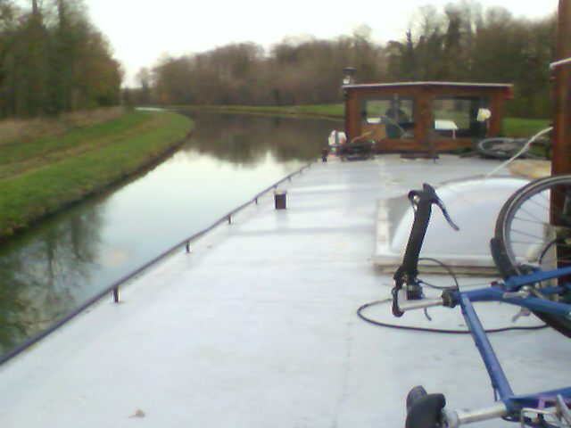 With a river boat at a canal in the north of France