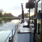 Houseboat in front of a north french river lock