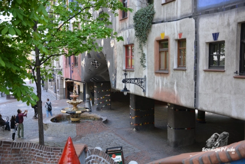 A playful sidewalk in front of the Hundertwasser house Vienna in Austria