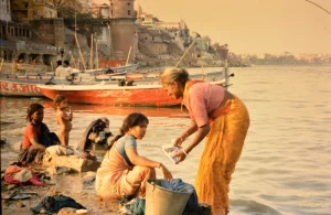 Clothe - washing women at the Ganga river in Varanasi