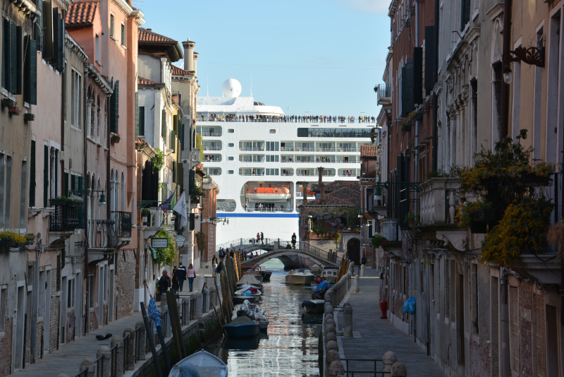 Cruising ship passes the old lagoon city Venice at the canal de Giudecca