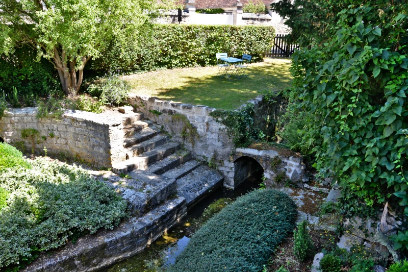 Saint-Jean-aux-Bois in France, little Garden in front of the Benedictine abbey Notre-Dame-Saint-Jean-Baptiste