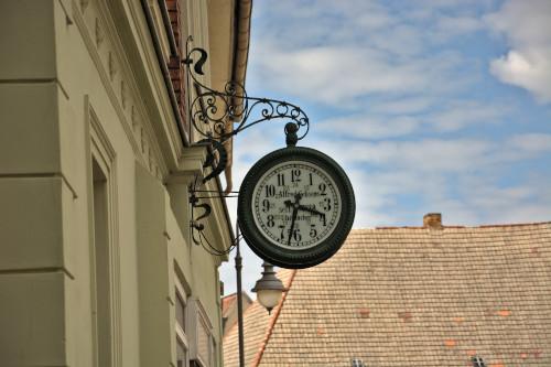 Clockmaker's sign at a house in Bad Schmiedeberg