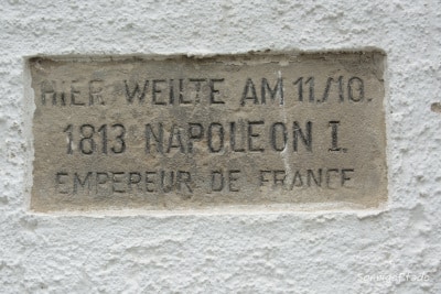 Memorial sandstone plaque at the castle walls refer to the visit of Napoleon I of France